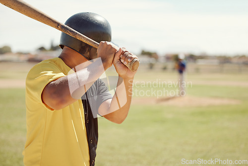 Image of Baseball, athlete and man with a bat on the pitch playing a sport game or fitness training. Sports, softball and man practicing his batting for a match at outdoor field or stadium with a wood baton.