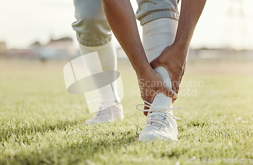 Image of Sports, field and man with ankle injury after game, competition or baseball performance workout. Emergency, training accident or athlete legs in pain after fitness, exercise or running on grass pitch