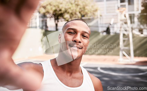 Image of Sports, smile and man taking a selfie on a basketball court after fitness training, cardio exercise and workout. Smile, portrait and happy black man taking pictures or photo outdoors in Chicago, USA