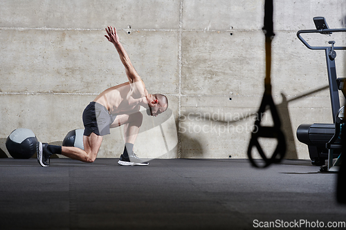 Image of A muscular man standing in the starting position for running, exuding determination and readiness for an intense fitness workout or athletic competition.