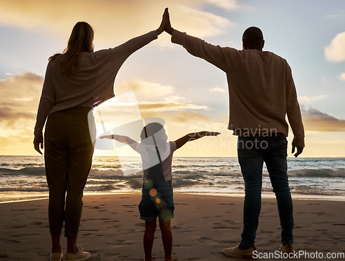 Image of Beach, love and family in unity together while on summer vacation, journey or adventure at the sea. Mother, father and girl child bonding in nature by the ocean water with sunset on seaside holiday.