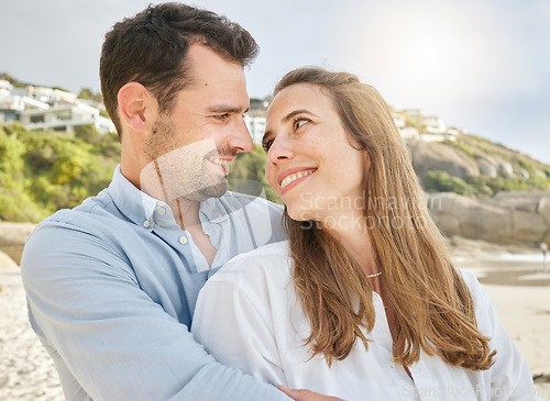 Image of Love, bond and couple hug on the beach, relax and enjoy romantic quality time together, peace or freedom. Marriage support, partnership trust and happy man and woman travel on Canada holiday vacation