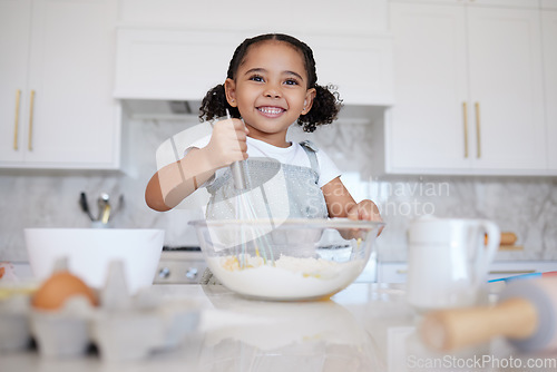 Image of Happy girl kids baking in kitchen, house and home for childhood fun, learning and development. Smile young toddler child, little cooking chef and mixing bowl, sweets dessert, cookies and cake flour