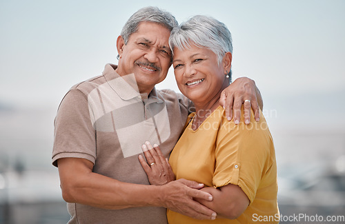 Image of Happy, love and portrait of a senior couple in retirement, bonding and embracing in nature. Happiness, smile and elderly man and woman from Puerto Rico hugging with care, romance and joy outdoors.