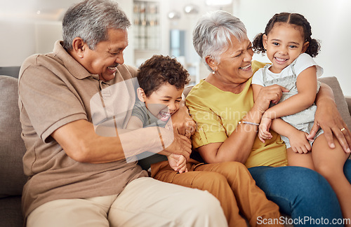 Image of Family, happy and grandparents with children on sofa playing tickle game for bonding fun in home. Love, care and joyful smile together in Mexico family home with grandma, grandfather and kids.