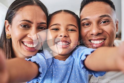 Image of Selfie, children and family with a girl, mother and father taking a photograph in their home together. Portrait, kids and love with a man, woman and daughter posing for a picture while bonding