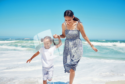 Image of Beach, mother and girl being happy, relax and playful for summer, vacation and holding hands together. Mama, child and daughter being joyful, enjoy seaside and smile while on travel for bonding.