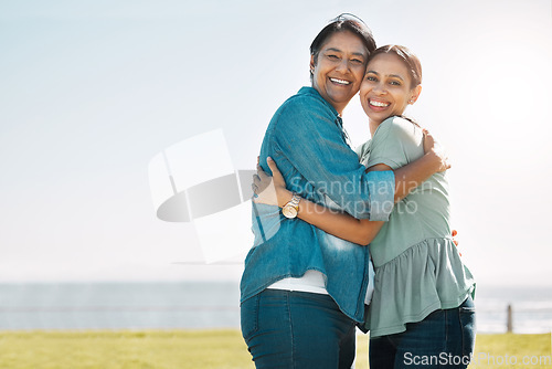 Image of Love, mother and outdoor adult daughter have hug happy, smile and bonding on vacation, adventure or holiday to embrace, beach or relax together. Portrait, mom and being cheerful, grateful at seaside.