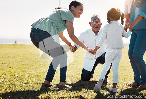 Image of Senior man, child and mother being outdoor, play and have fun while on seaside holiday, vacation and travel in summer. Mama, daughter and on field holding hands in circle, smile and happy together.