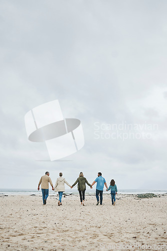 Image of Holiday, family and walking beach in summer vacation, travel and freedom in South Africa. Love, freedom and care grandparents, parents and kid relax, bond and enjoy winter ocean trip together