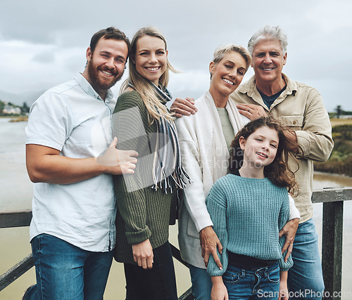 Image of Family, travel and vacation with a girl, parents and grandparents on holiday or a weekend getaway by a lake. Nature, children and portrait with a happy group of relatives outdoor on the water