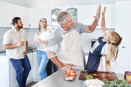 Image of High five, happy family and cooking together success in kitchen bonding activity. Parents smile, senior man teach kid to make healthy lunch and good job child development through learning at home