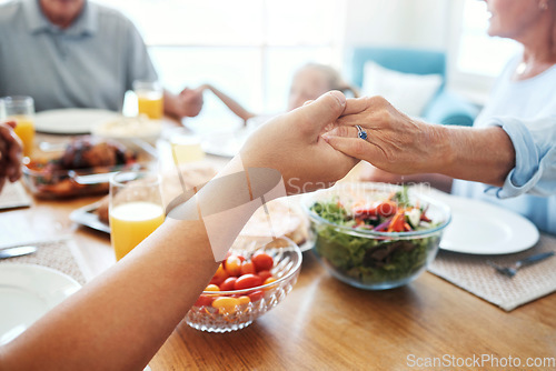 Image of Christian, family and pray for food holding hands for lunch together at home dining table. Faith, gratitude and prayer of thanks to God for meal with young and senior relatives in house.