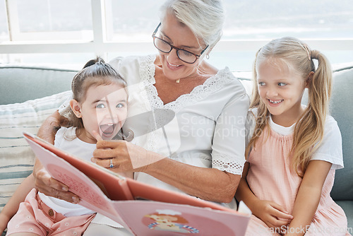 Image of Grandmother, children and reading books on living room sofa in family home educational learning, funny and happy development. Grandma, girls and girl kids laughing, teaching story and relax on couch