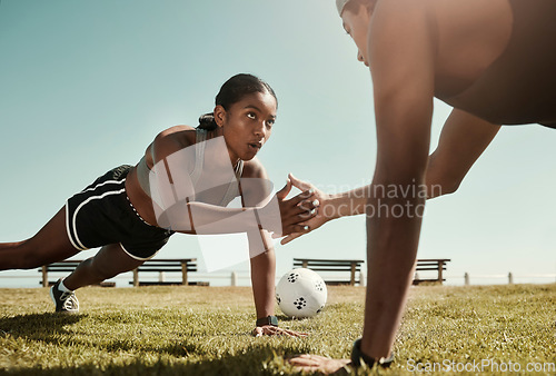 Image of Fitness partner, exercise and sport training with couple workout in a park doing pushup for wellness in nature. Breathing, soccer ball and woman with man personal trainer for strength and health