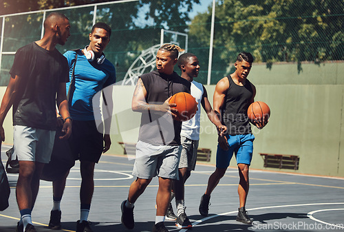 Image of Sports, team and basketball player friends walking off together after street game, competition or practice match. Basketball court, fitness and black people talking after workout or training exercise