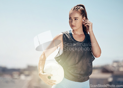 Image of Woman, soccer ball or thinking of fitness goals, training match target or Canada city workout game. Football player, sports athlete or exercise coach listening to health radio music or winner podcast