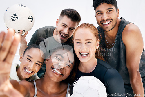 Image of Happy, selfie and portrait of friends with soccer ball after training for a match together. Happiness, diversity and team with a smile holding sports balls while taking a picture during game practice