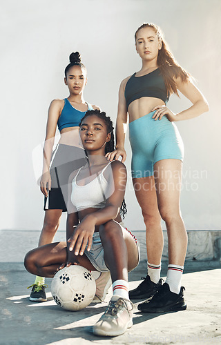 Image of Team sports, football and portrait of friends standing together with ball on city court outdoors. Woman diversity, sport fitness health and girlfriends empowerment or support before competition match