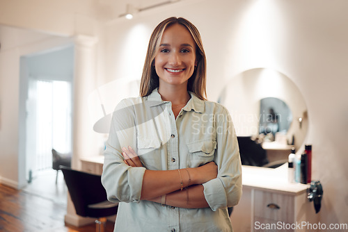 Image of Salon, small business and owner with a woman stylist standing arms crossed in her workshop. Hairdresser, startup and entrepreneur with a female beautician working in the beauty or hair industry