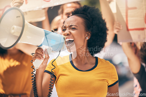 Image of Protest, megaphone and speech of angry black woman at rally. Loudspeaker, revolution and speaking, screaming or shouting leader on bullhorn protesting for human rights, justice and freedom in city.