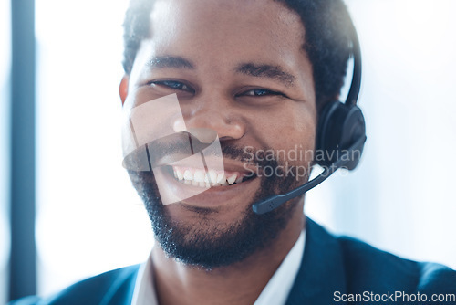 Image of Call center, telemarketing and black man working as support, customer service or crm agent with headphones in office. Portrait, smile and face of guy as sales consultant at contact us company