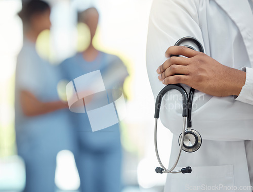 Image of Hospital, medical and hands of doctor with stethoscope for professional cardiology exam closeup. Healthcare, cardiologist and diagnostic equipment for heart expert treatment in workspace.