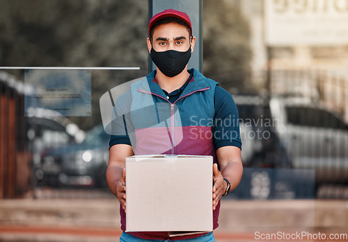 Image of Delivery man, box and covid face mask working for courier service with package, shipment or parcel outdoor. Express, logistics and portrait of guy ready to deliver ecommerce order during coronavirus