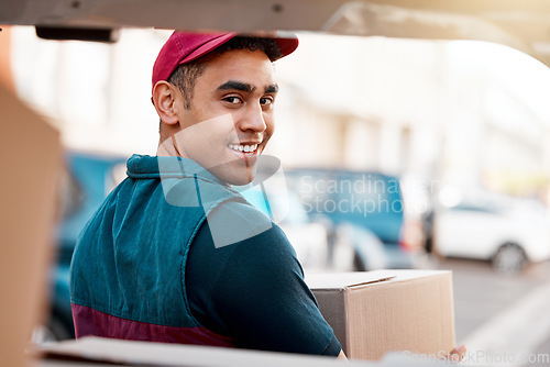 Image of Logistics, smile and man with box at van looking back, trust and success in courier service for ecommerce business. Supply chain, cargo and stock distribution, delivery driver at truck with package.