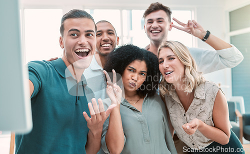 Image of Happy employees, selfie and team building in office for business people happy, smile and peace sign posing for picture. Diversity, teamwork and collaboration photo with fun men and women work friends