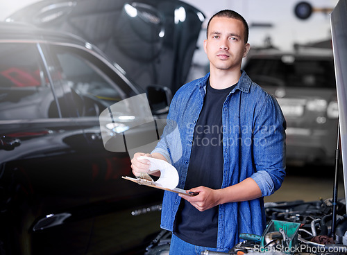 Image of Car, engineering and mechanic with a checklist at a workshop or garage for auto inspection and maintenance. Industrial, services and worker working on motor oil, pipe leaks repair and checking safety