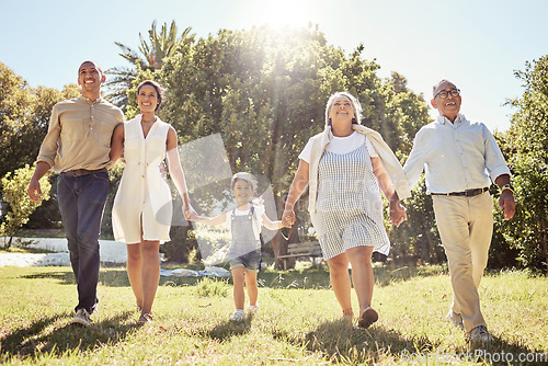 Image of Black happy family, holding hands and walk in nature park bonding together on summer vacation outdoors. Grandparents, parents and child fun in sun, relationship support and cheerful relax activity.