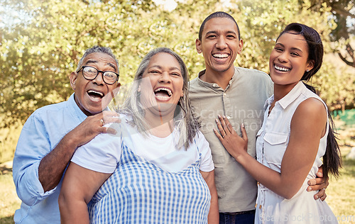 Image of Happy family, laughing and relax at a park together with couple bonding with senior parents in nature. Love, family and reunion in a forest with portrait of laughing people enjoying quality time