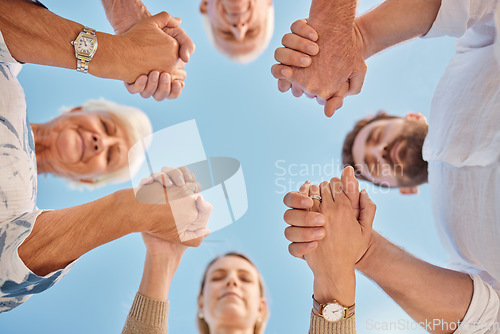 Image of Family, group and holding hands in circle for praying, faith and bonding together outdoor. Mom, dad and grandparents with spiritual, sky and religion for God, happiness and closed eyes in gratitude