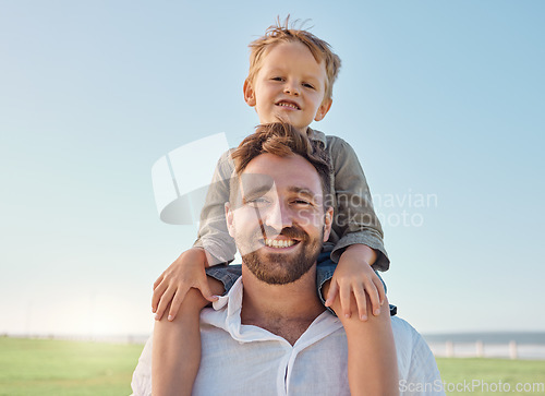 Image of Family, father and child with smile at nature park for fun, relax and freedom with a blue sky. Portrait of happy man and playful boy kid outdoor for love, piggyback and bonding on a summer vacation