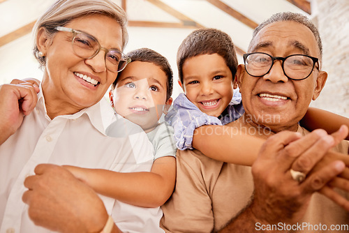 Image of Grandparents, hug and children together at a house with happiness, family love and child care. Portrait of happy elderly people with kids smiling, bonding and spending quality time at a family home