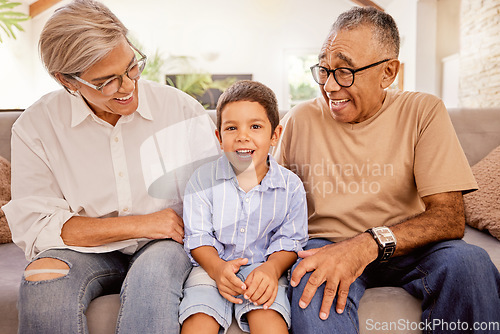 Image of Relax, happy and grandparents with child on sofa together for smile, love and retirement. Peace, youth and portrait of old man and woman with kid in living room in family home for care, hug and calm