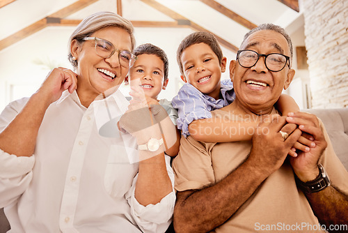 Image of Grandparents, children and sofa happy in home living room on vacation or holiday together. Kids, grandma and grandpa in retirement smile on couch in lounge with love for family portrait in house