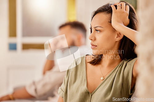 Image of Angry, argue and divorce with a black woman ignoring her husband while sitting on a sofa in the living room. Stress, couple and fight with a wife feeling anger during a conflict with her cheating man