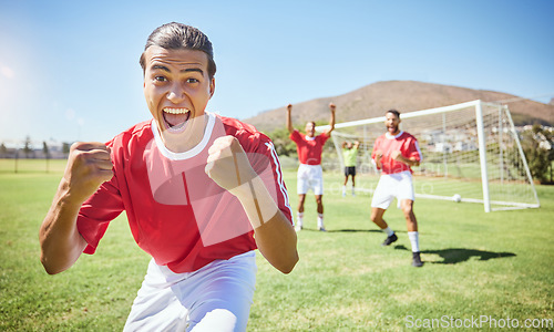 Image of Soccer player, celebrate and winning team with fist in celebration of scoring goal for sport match, game or competition with success gesture. Victory and fun with men training on football field