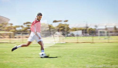 Image of Football, running and soccer man with a ball doing a sport exercise, workout and training. Speed, action and young male athlete in a sports team uniform run a fitness cardio on a grass field