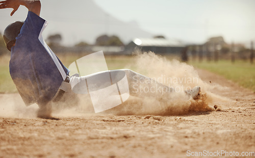 Image of Baseball, baseball player running and diving for home plate in dirt during sport ball game competition on sand of baseball pitch. Sports man, ground slide and summer fitness training at Dallas Texas