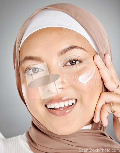 Image of Skincare cream, hijab and muslim woman with a smile using beauty lotion and skin moisturizer. Portrait of a happy face of a person from Iran using a cosmetic serum for anti aging and wellness