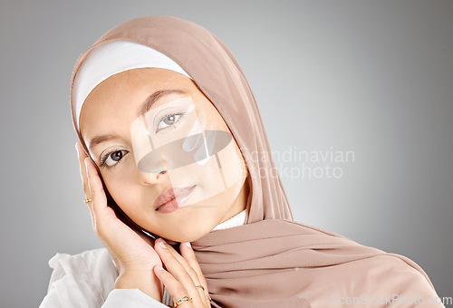 Image of Hijab, skincare cream and muslim woman with natural beauty, face lotion and skin wellness treatment. Portrait of a model person from Iran wearing cosmetic serum, youth moisturizer and facial wash