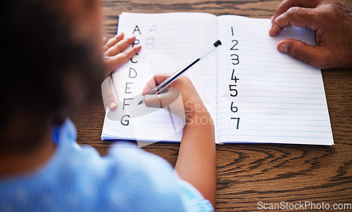 Image of Teacher, learning and child hands writing in book with tutor for education, alphabet and maths. Knowledge, teaching and student with homework book for studying lesson at desk with top view.