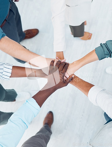 Image of Diversity, partnership collaboration and hands of business people stack in community support, trust and solidarity. Mission teamwork, team building meeting and businessman and women together top view