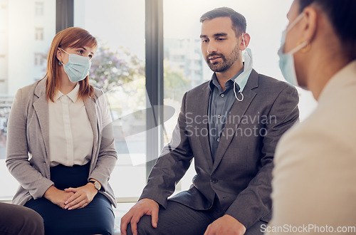 Image of Covid, business people and office meeting with leader, manager or coach talking for counseling, therapy or support. Corporate women and man group with face mask during coronavirus for development