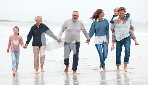 Image of Beach, walking and big family on exercise while on vacation in Australia during summer in water. Happy Grandparents, parents and children on outdoor health walk while on adventure, journey or holiday