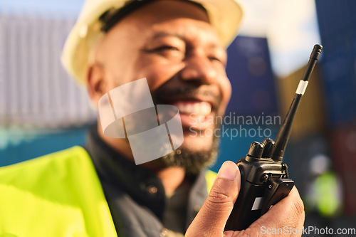Image of Delivery, shipping and construction worker talking on radio in shipyard. Black man with walkie talkie for communication in logistics, distribution and import and export business with cargo container