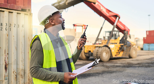 Image of Black man engineer, checklist and container manager planning distribution, shipping and delivery logistics. African supply chain stock and cargo worker on walkie talkie for freight industry business